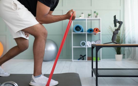 Man performing exercises on Studio Reformer Tower at Intelligent Movement